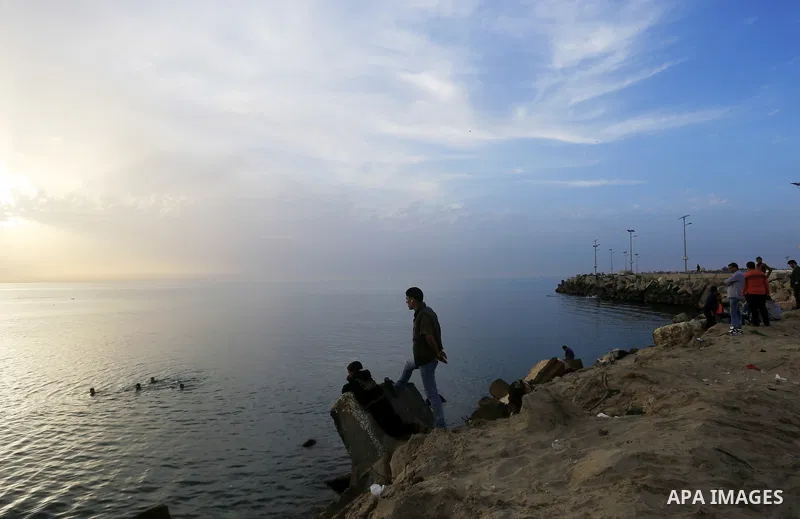Palestinians enjoy a day at the beach of the Mediterranean sea on the coast of Gaza city, on March 09, 2016. Photo by Yasser Qudih
