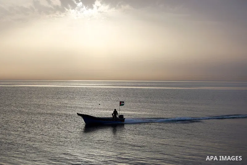 Palestininas ride a boat in the Mediterranean sea on the coast of Gaza city, on March 09, 2016. Photo by Yasser Qudih