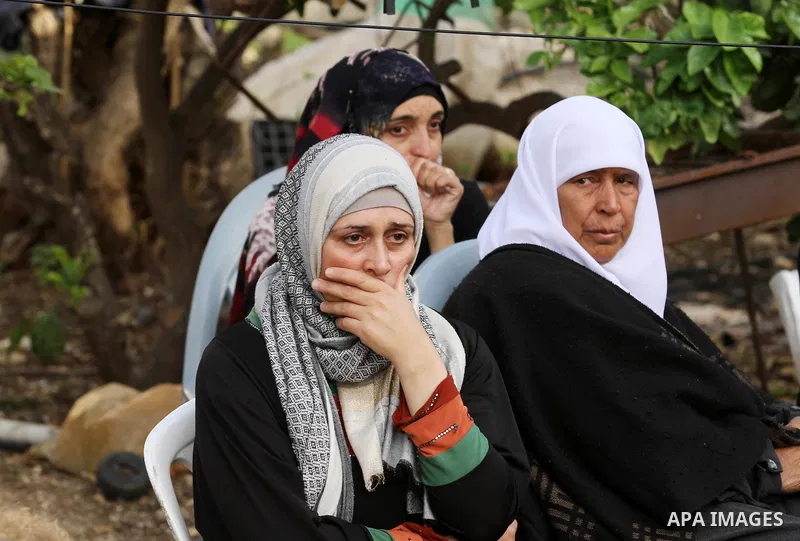 Relatives of Palestinian Ahmad Aamer, 16, who the Israeli military said was shot dead by Israeli soldiers after he tried to stab them mourn during his funeral in the West Bank village of Mas'ha near Salfit March 9, 2016....