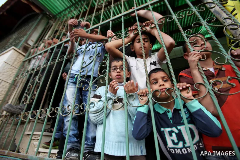Relatives of Palestinian Ahmad Aamer, 16, who the Israeli military said was shot dead by Israeli soldiers after he tried to stab them mourn during his funeral in the West Bank village of Mas'ha near Salfit March 9, 2016....