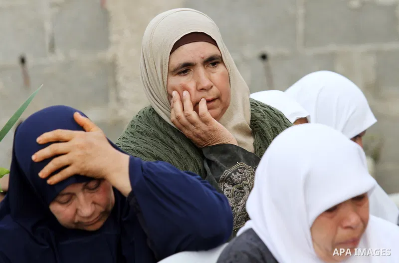 Relatives of Palestinian Ahmad Aamer, 16, who the Israeli military said was shot dead by Israeli soldiers after he tried to stab them mourn during his funeral in the West Bank village of Mas'ha near Salfit March 9, 2016....