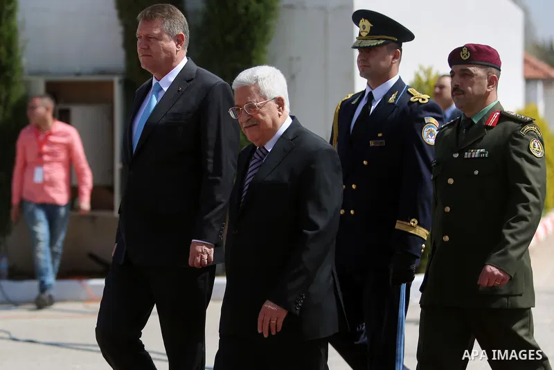 Romanian President Klaus Iohannis reviews honor guard with Palestinian president Mahmoud Abbas upon his arrival to the West Bank city of Ramallah on March 10, 2016. Photo by Shadi Hatem