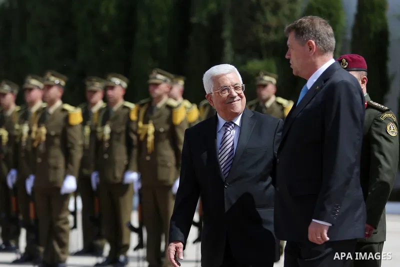 Romanian President Klaus Iohannis reviews honor guard with Palestinian president Mahmoud Abbas upon his arrival to the West Bank city of Ramallah on March 10, 2016. Photo by Shadi Hatem