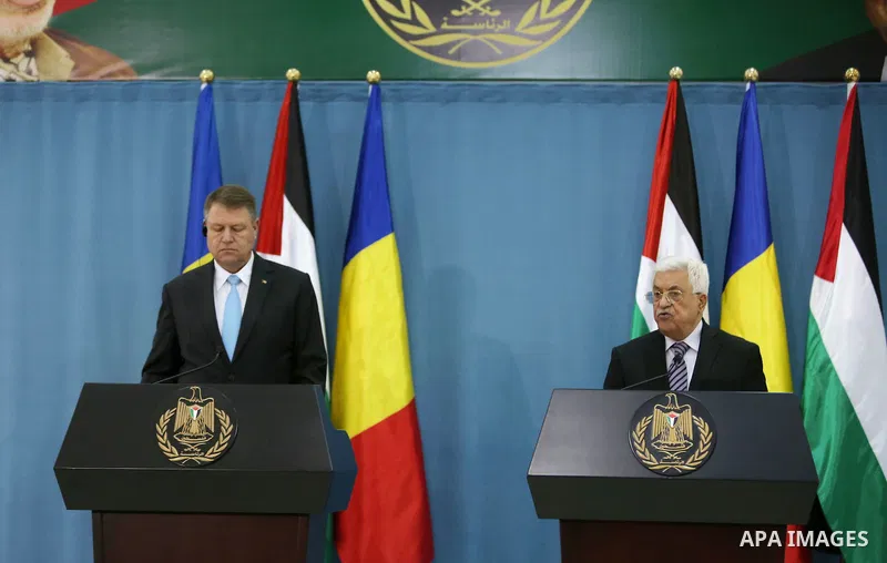 Palestinian President Mahmud Abbas (R) and Romanian President Klaus Iohannis give a joint press conference in the West Bank city of Ramallah on March 10, 2016. Photo by Shadi Hatem
