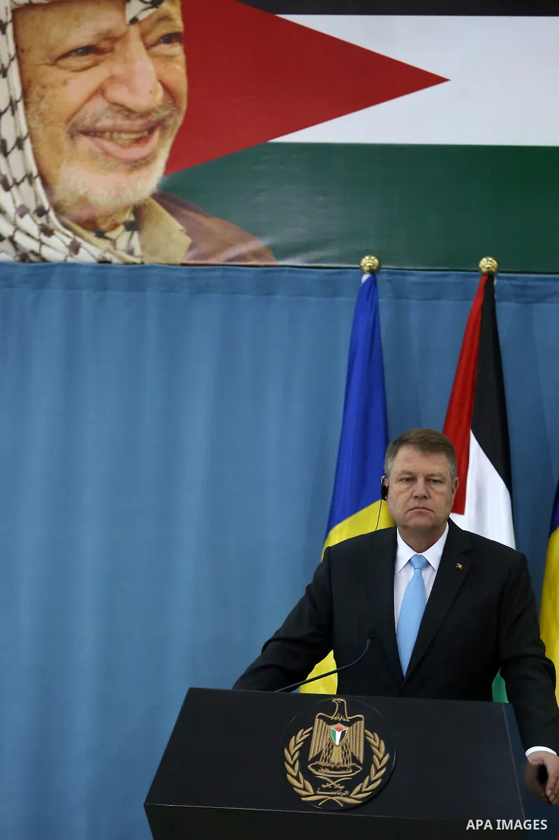 Romanian President Klaus Iohannis gives a joint press conference in the West Bank city of Ramallah on March 10, 2016. Photo by Shadi Hatem