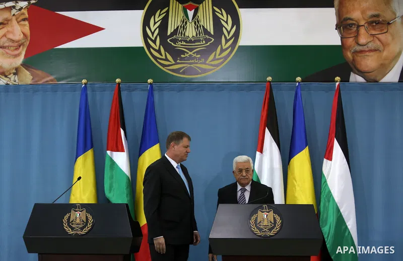 Palestinian President Mahmud Abbas (R) and Romanian President Klaus Iohannis give a joint press conference in the West Bank city of Ramallah on March 10, 2016. Photo by Shadi Hatem