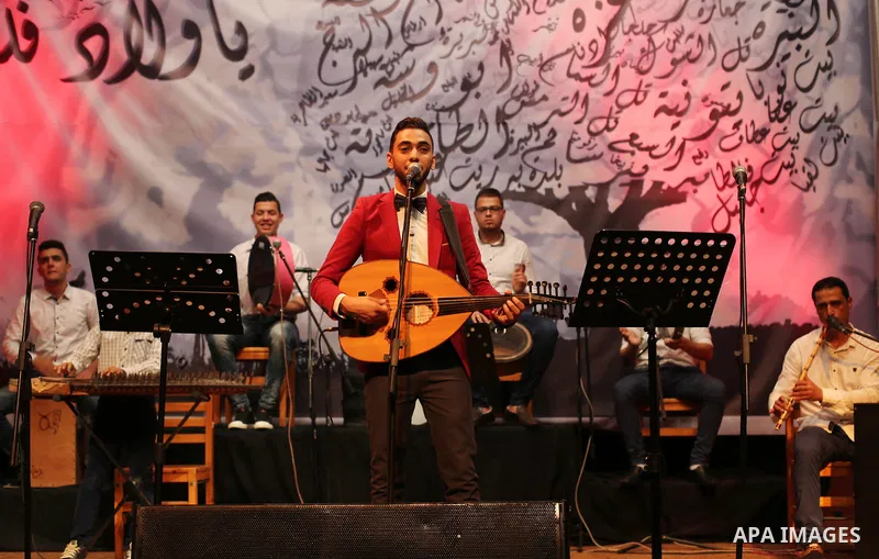 Members of Palestinian musical band perform during a singing ceremony in Gaza city on March 10, 2016. Photo by Mohammed Asad