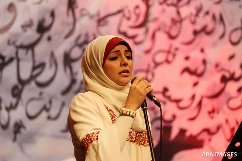 Members of Palestinian musical band perform during a singing ceremony in Gaza city on March 10, 2016. Photo by Mohammed Asad