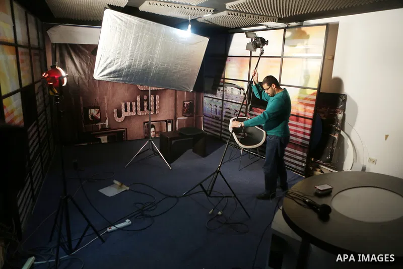 Palestinian employees of Palestine Today television inspect the damage at the station's offices after it had been raided by Israeli forces overnight on March 11, 2016, in the West Bank city of Ramallah. Israeli forces ra...