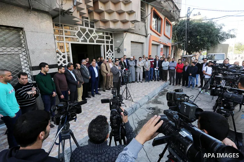 Palestinian Journalists take part during a protest to show solidarity with Palestine Today television after it had been raided by Israeli forces overnight on March 11, 2016 in Gaza city. Israeli forces raided the TV's of...