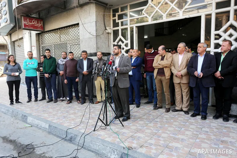 Palestinian Journalists take part during a protest to show solidarity with Palestine Today television after it had been raided by Israeli forces overnight on March 11, 2016 in Gaza city. Israeli forces raided the TV's of...