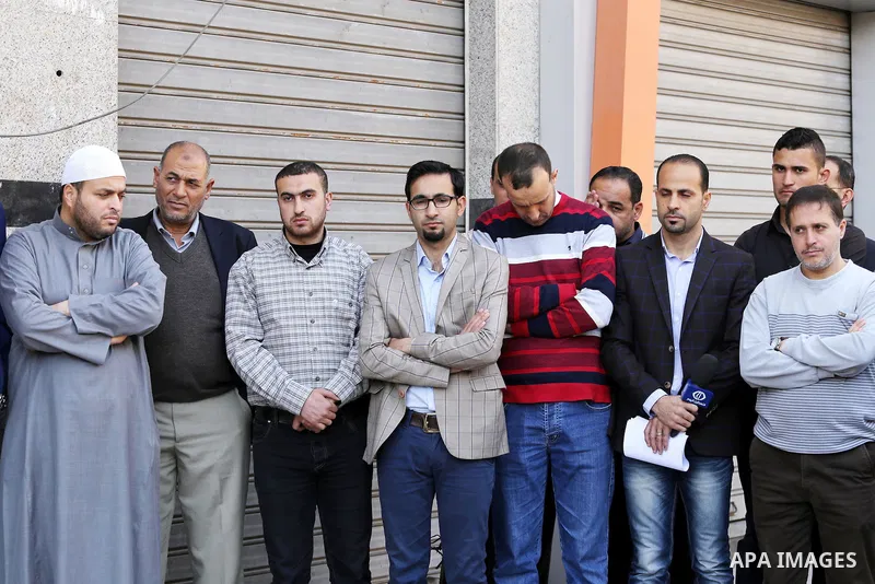 Palestinian Journalists take part during a protest to show solidarity with Palestine Today television after it had been raided by Israeli forces overnight on March 11, 2016 in Gaza city. Israeli forces raided the TV's of...