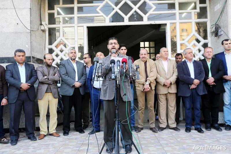 Palestinian Journalists take part during a protest to show solidarity with Palestine Today television after it had been raided by Israeli forces overnight on March 11, 2016 in Gaza city. Israeli forces raided the TV's of...