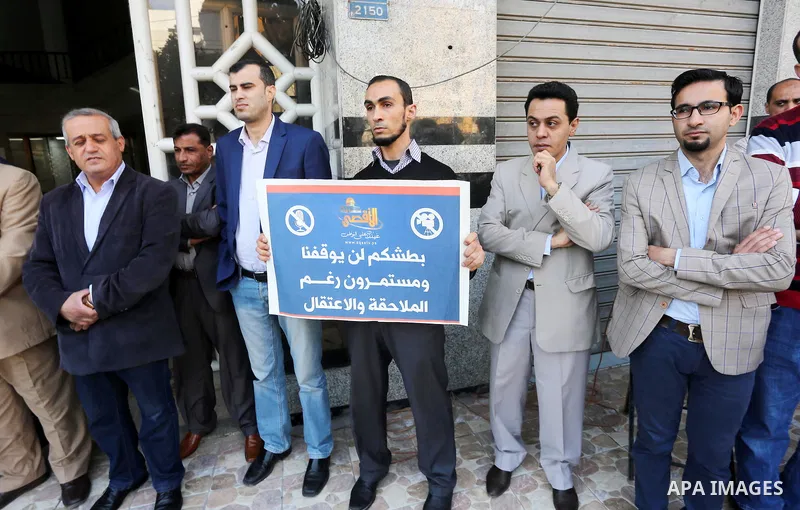 Palestinian Journalists take part during a protest to show solidarity with Palestine Today television after it had been raided by Israeli forces overnight on March 11, 2016 in Gaza city. Israeli forces raided the TV's of...