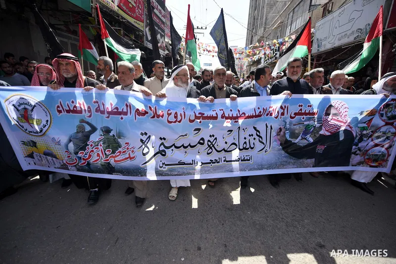 Palestinian supporters of the Islamic Jihad Movement take part in a demonstration in support of the second "intifada", or uprising, in 2000 on March 11, 2016 following the Friday prayers in Khan Yunis in the southern Gaz...