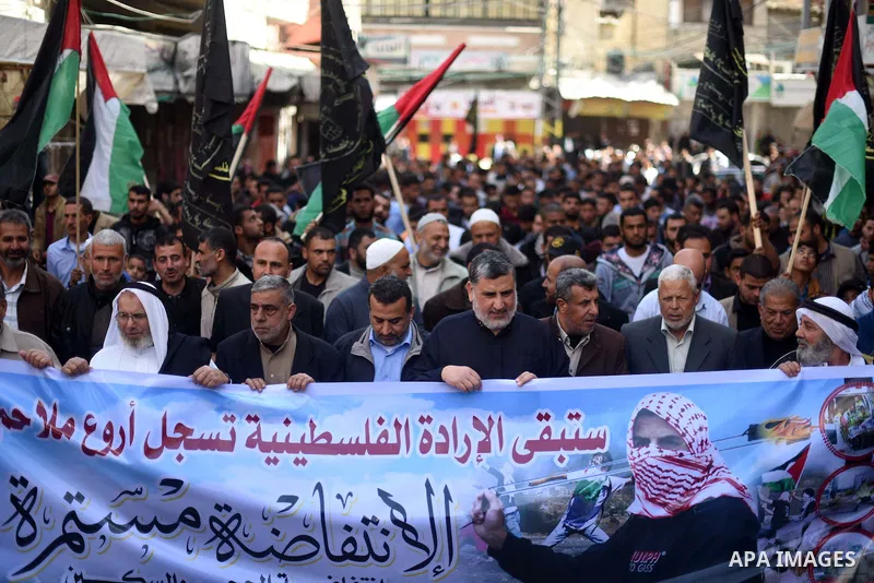 Palestinian supporters of the Islamic Jihad Movement take part in a demonstration in support of the second "intifada", or uprising, in 2000 on March 11, 2016 following the Friday prayers in Khan Yunis in the southern Gaz...