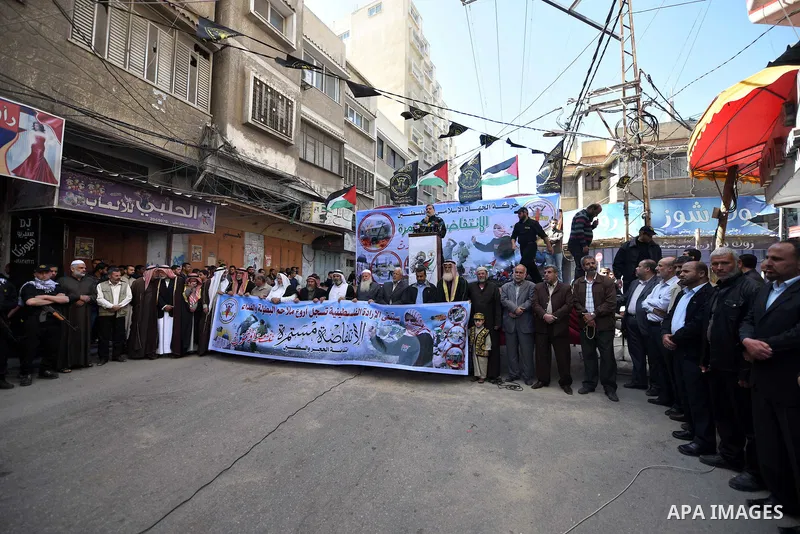 Palestinian supporters of the Islamic Jihad Movement take part in a demonstration in support of the second "intifada", or uprising, in 2000 on March 11, 2016 following the Friday prayers in Khan Yunis in the southern Gaz...