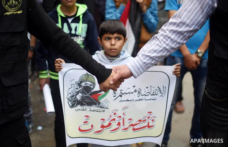Palestinian supporters of the Islamic Jihad Movement take part in a demonstration in support of the second "intifada", or uprising, in 2000 on March 11, 2016 following the Friday prayers in Khan Yunis in the southern Gaz...
