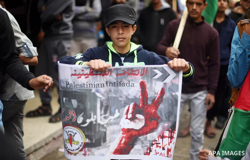 Palestinian supporters of the Islamic Jihad Movement take part in a demonstration in support of the second "intifada", or uprising, in 2000 on March 11, 2016 following the Friday prayers in Khan Yunis in the southern Gaz...