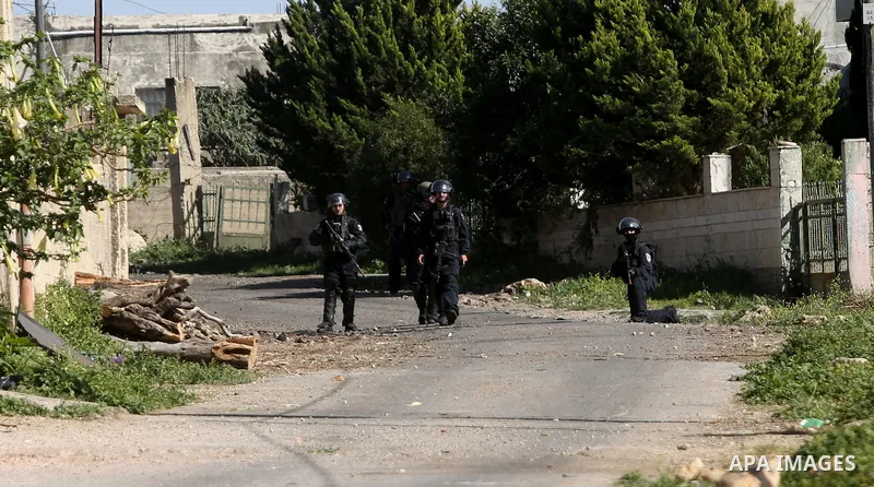 Israeli security forces take position during clashes with Palestinian protestors following a demonstration against the expropriation of Palestinian land by Israel in the village of Kfar Qaddum, near Nablus, in the occupi...