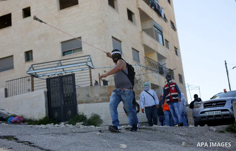 Palestinian protesters clash with Israeli security forces on March 11, 2016, following a demonstration in solidarity with Palestinian prisoners held in Israeli jails, outside the compound of the Israeli-run Ofer prison n...