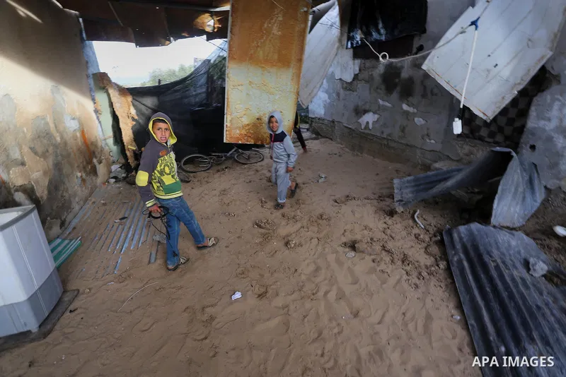 A Palestinian boy inspects a bedroom of the damaged Khussa family home after an Israeli strike on Hamas bases in Beit Lahiya, northern Gaza strip on March 12, 2016. Israeli planes struck Hamas bases in the Gaza Strip ear...