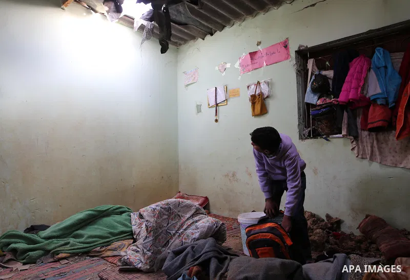 A Palestinian boy inspects a bedroom of the damaged Khussa family home after an Israeli strike on Hamas bases in Beit Lahiya, northern Gaza strip on March 12, 2016. Israeli planes struck Hamas bases in the Gaza Strip ear...