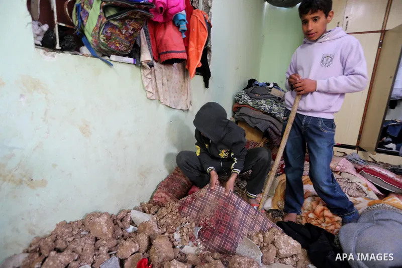 A Palestinian boy inspects a bedroom of the damaged Khussa family home after an Israeli strike on Hamas bases in Beit Lahiya, northern Gaza strip on March 12, 2016. Israeli planes struck Hamas bases in the Gaza Strip ear...