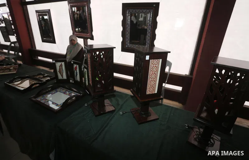 Palestinian Female Prisoners take part in an exhibition of art works and handicrafts products organized by the Ministry of Interior, in Gaza city on March 12, 2016. Photo by Mohammed Asad
