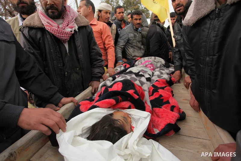 Palestinian mourners carry the body of Israa Abu Khussa, 6, during her funeral on March 12, 2016 in Beit Lahiya in the north of the Gaza strip. Israeli planes struck the bases of the Hamas group's military wing, the Ezze...