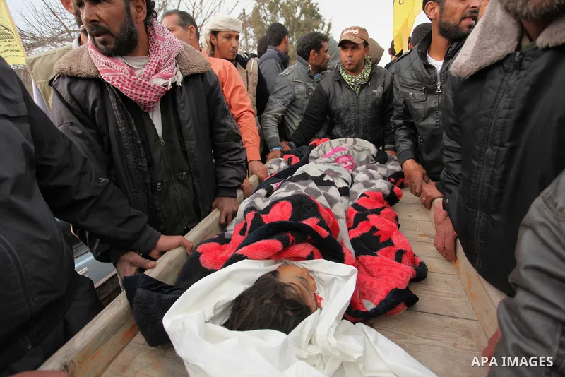 Palestinian mourners carry the body of Israa Abu Khussa, 6, during her funeral on March 12, 2016 in Beit Lahiya in the north of the Gaza strip. Israeli planes struck the bases of the Hamas group's military wing, the Ezze...