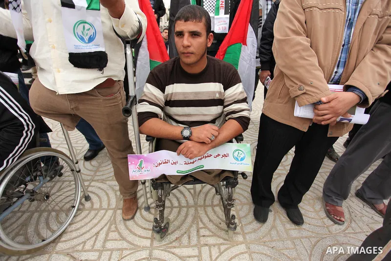 Palestinian Woundeds take part in a rally on the occasion of the Palestinian Wounded's Day in Gaza City on March 13, 2016. Photo by Ashraf Amra