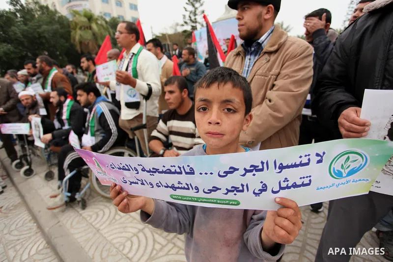 Palestinian Woundeds take part in a rally on the occasion of the Palestinian Wounded's Day in Gaza City on March 13, 2016. Photo by Ashraf Amra
