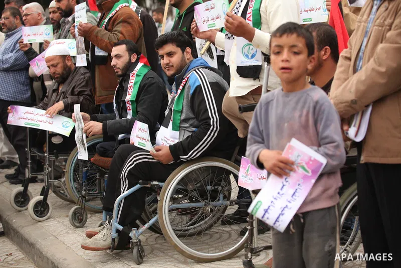 Palestinian Woundeds take part in a rally on the occasion of the Palestinian Wounded's Day in Gaza City on March 13, 2016. Photo by Ashraf Amra