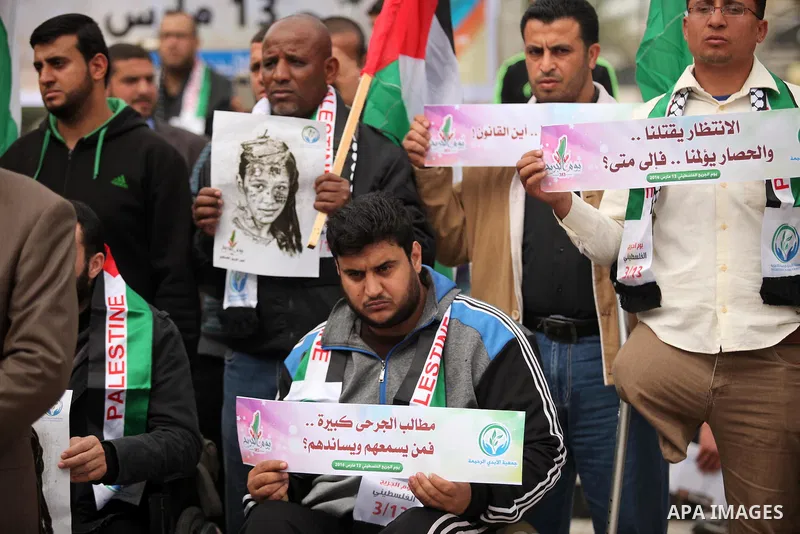 Palestinian Woundeds take part in a rally on the occasion of the Palestinian Wounded's Day in Gaza City on March 13, 2016. Photo by Ashraf Amra