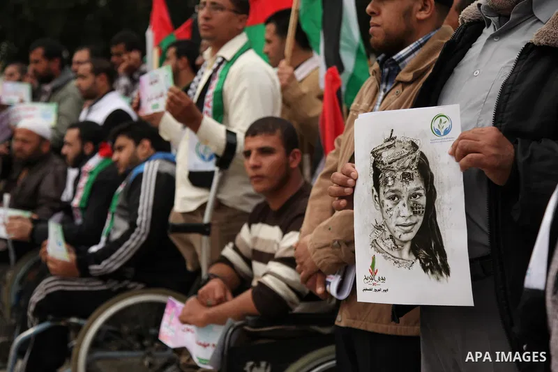 Palestinian Woundeds take part in a rally on the occasion of the Palestinian Wounded's Day in Gaza City on March 13, 2016. Photo by Ashraf Amra