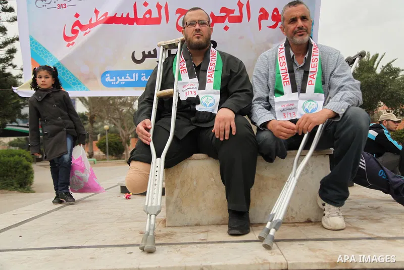 Palestinian Woundeds take part in a rally on the occasion of the Palestinian Wounded's Day in Gaza City on March 13, 2016. Photo by Ashraf Amra