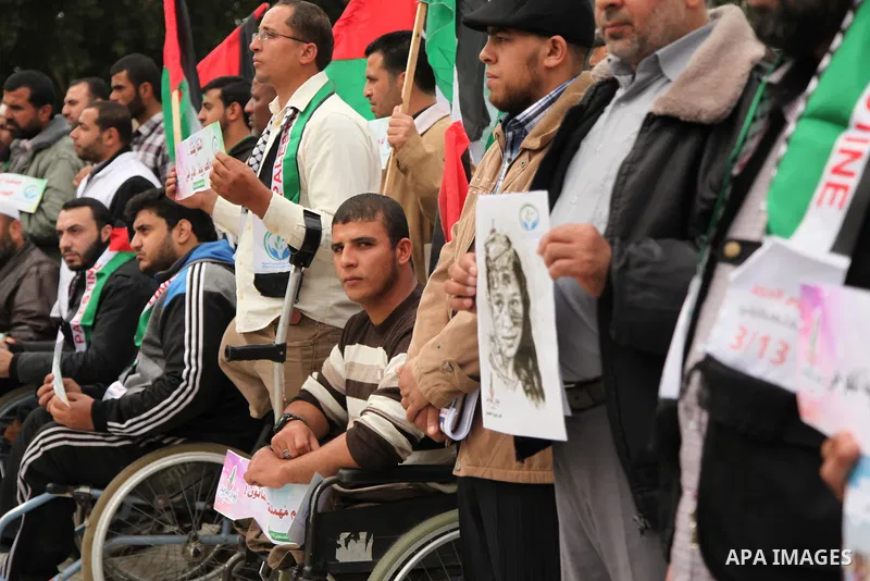 Palestinian Woundeds take part in a rally on the occasion of the Palestinian Wounded's Day in Gaza City on March 13, 2016. Photo by Ashraf Amra