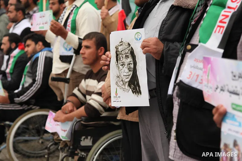 Palestinian Woundeds take part in a rally on the occasion of the Palestinian Wounded's Day in Gaza City on March 13, 2016. Photo by Ashraf Amra