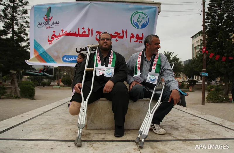 Palestinian Woundeds take part in a rally on the occasion of the Palestinian Wounded's Day in Gaza City on March 13, 2016. Photo by Ashraf Amra