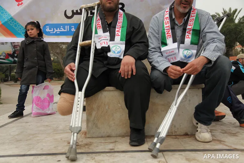 Palestinian Woundeds take part in a rally on the occasion of the Palestinian Wounded's Day in Gaza City on March 13, 2016. Photo by Ashraf Amra