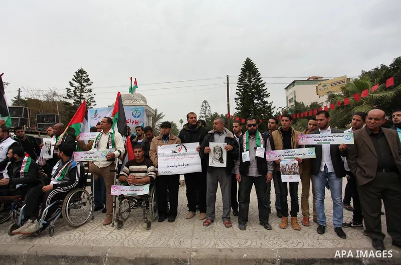 Palestinian Woundeds take part in a rally on the occasion of the Palestinian Wounded's Day in Gaza City on March 13, 2016. Photo by Ashraf Amra