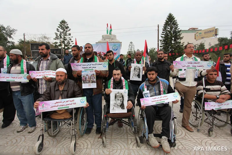 Palestinian Woundeds take part in a rally on the occasion of the Palestinian Wounded's Day in Gaza City on March 13, 2016. Photo by Ashraf Amra