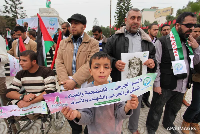 Palestinian Woundeds take part in a rally on the occasion of the Palestinian Wounded's Day in Gaza City on March 13, 2016. Photo by Ashraf Amra