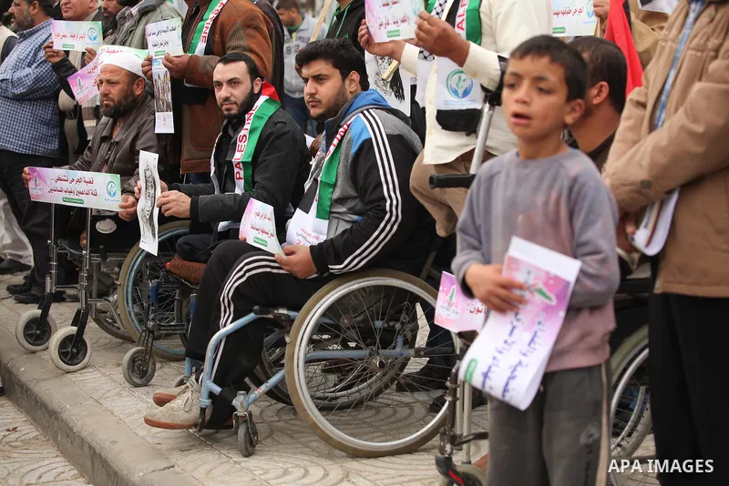 Palestinian Woundeds take part in a rally on the occasion of the Palestinian Wounded's Day in Gaza City on March 13, 2016. Photo by Ashraf Amra