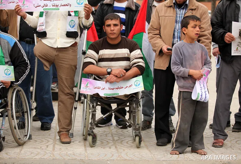 Palestinian Woundeds take part in a rally on the occasion of the Palestinian Wounded's Day in Gaza City on March 13, 2016. Photo by Ashraf Amra