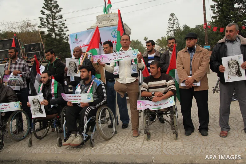 Palestinian Woundeds take part in a rally on the occasion of the Palestinian Wounded's Day in Gaza City on March 13, 2016. Photo by Ashraf Amra
