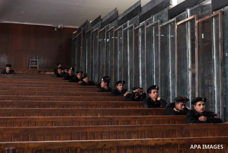 Egyptian policemen sit guard during the trial of Egyptian former interior minister Habib al-Adly on the charges of corruption, in Cairo, Egypt on March 13, 2016. Habib al-Adly served as interior minister of Egypt from 19...