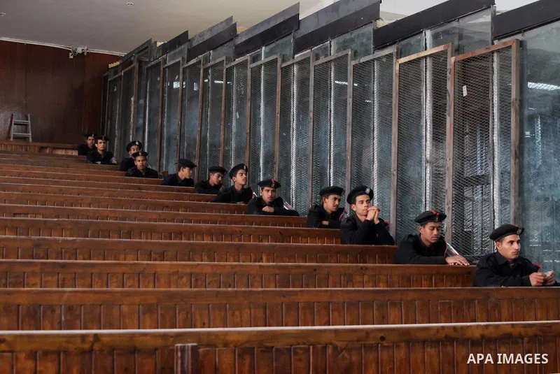 Egyptian policemen sit guard during the trial of Egyptian former interior minister Habib al-Adly on the charges of corruption, in Cairo, Egypt on March 13, 2016. Habib al-Adly served as interior minister of Egypt from 19...