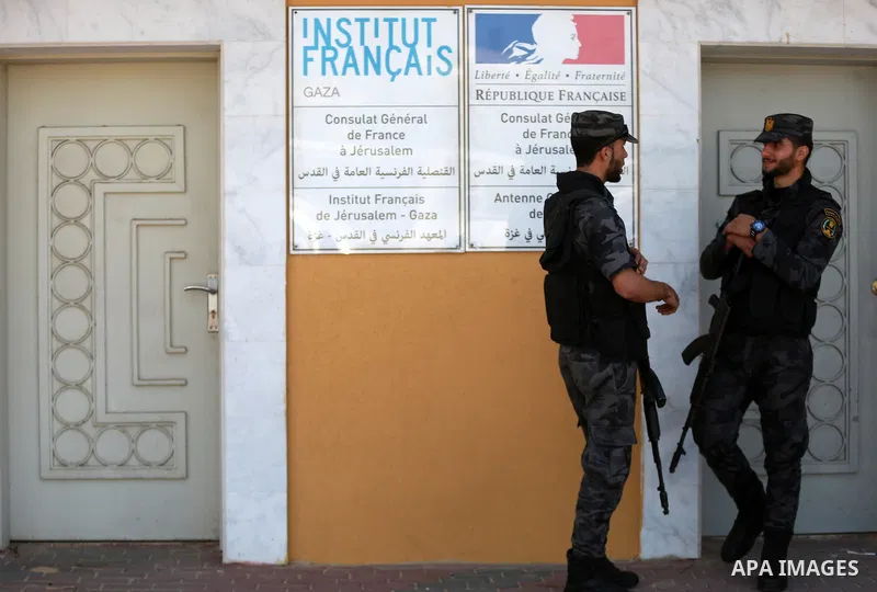 Palestinian policemen stand guard during a protest to solidarity with al-Aqsa TV channel which it removing from EUTELSAT, in Gaza City on March 14, 2016. Israeli Prime Minister Benjamin Netanyahu said Sunday that Israel...